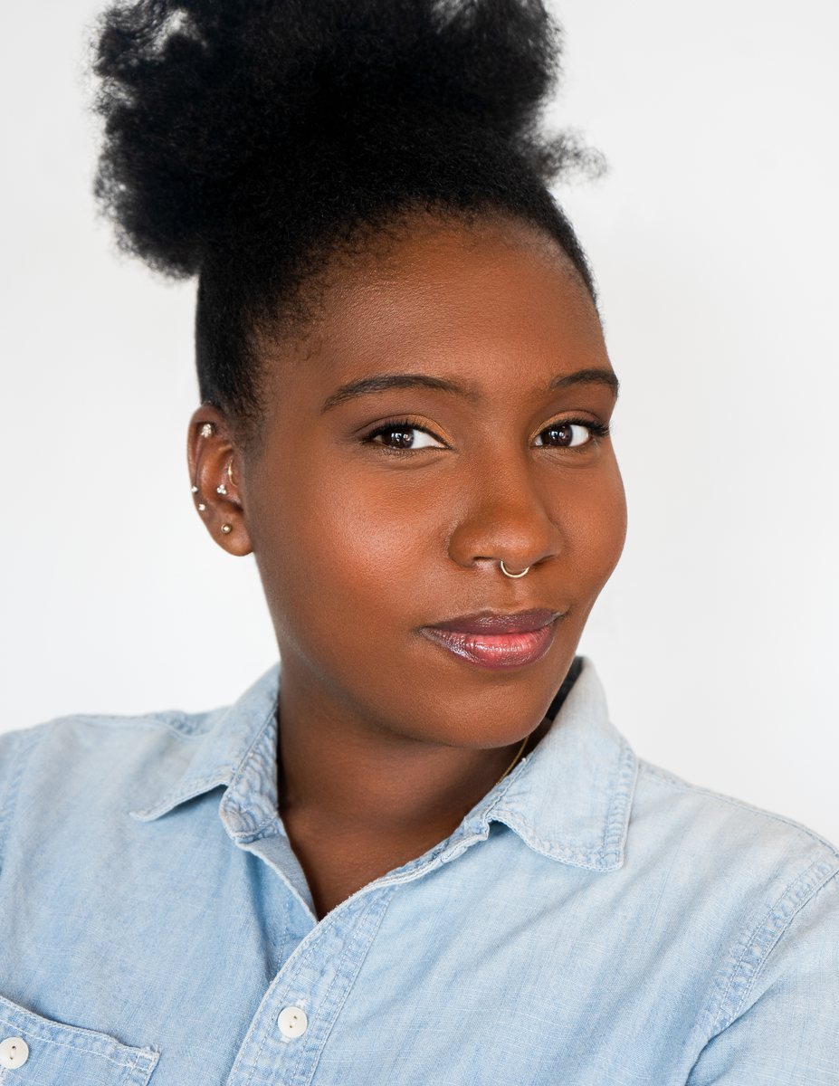 Actor headshot, woman in a denim shirt on white