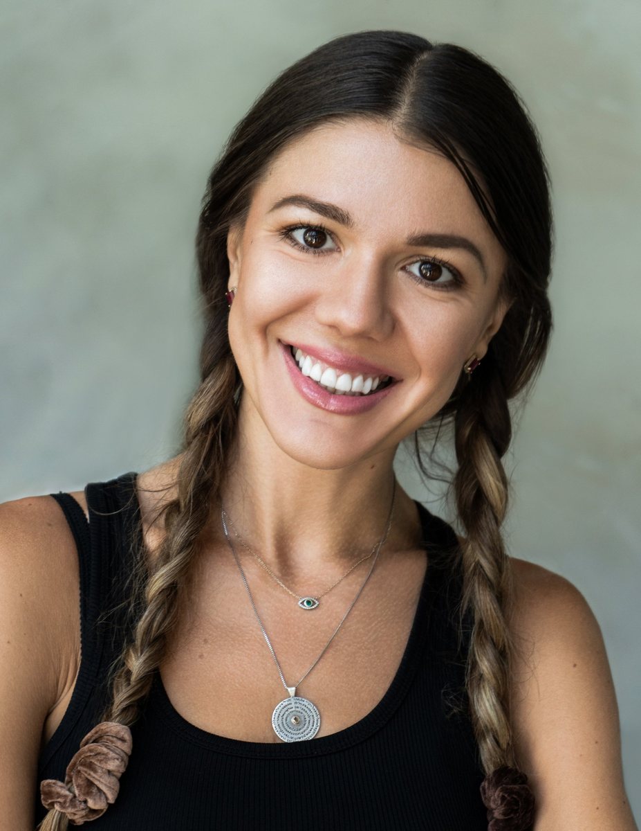 Commercial headshot, smiling woman with braids